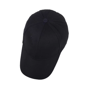 Close-up of black cotton twill baseball cap showing breathable eyelets and fine stitching
