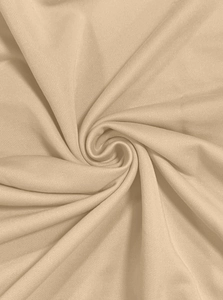 Macro shot of apricot fleece fabric texture with soft knit spiral fold details