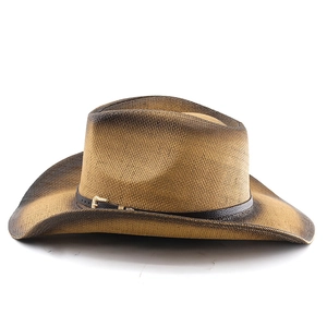 Detail of straw cowboy hat with brown gradient brim and leather band with metal buckle