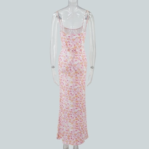 Detail view of pink floral backless dress with adjustable waist tie on transparent mannequin