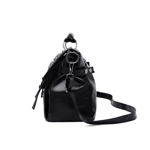 Women's black punk rock style handbag with silver rivets and metal ring handle in leather