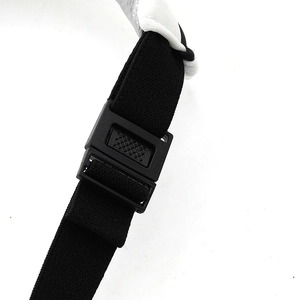 Detail of adjustable black elastic strap with textured plastic buckle on sun visor hat