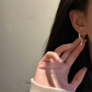 Minimalist S925 sterling silver hoop earrings with water drop pendants on female model