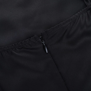 Macro detail of high-quality invisible zipper on black satin dress fabric