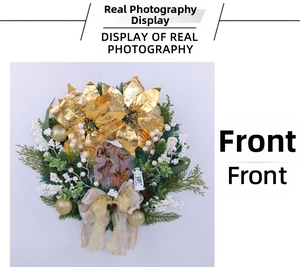 Detail of Christmas wreath with golden flowers, berries, and religious Nativity center