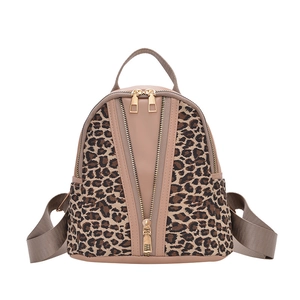 Fashionable leopard print backpack with minimalist design and multiple zipper compartments