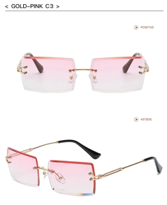 Detail view of rimless rectangular sunglasses with gold temples and pink gradient lenses