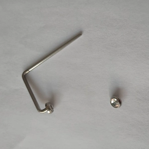 Close-up of L-shaped silver 316L stainless steel nose stud with a clear crystal zircon