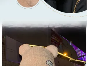 Detail of beige teddy plush hat featuring cute bear ears and thick fleece lining for winter