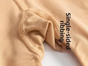 Macro detail of skin-toned leggings featuring a single-sided gusset for extra comfort