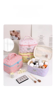 Quilted floral makeup bag set with top handle and double zippers in pastel colors
