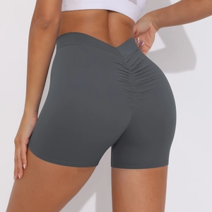 Close-up of the high-waisted dark grey yoga shorts featuring a scrunch butt lifting design