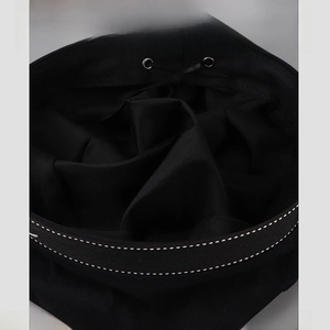 Detail of black beret interior featuring adjustable drawstring and metal eyelets