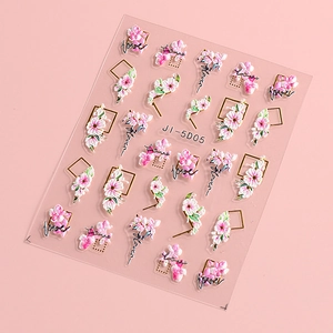 Detail of 5D embossed nail art stickers with pink camellia flowers and gold geometric frames