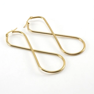 Elegant gold infinity symbol hoop earrings in titanium steel for women in studio light