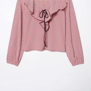 Women's red gingham long sleeve blouse with ruffled collar and tie neck on white background