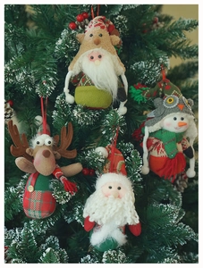 Detail of Christmas tree plush ornaments featuring Santa, reindeer and snowman on snow branches