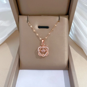 Rose gold hexagram necklace with pink gemstone and zircons in a jewelry box