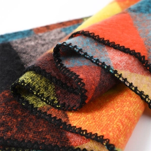 Detailed close-up showing the wool-like texture and geometric knit blocks of this winter scarf