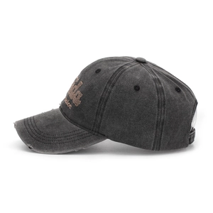 Close-up of washed cotton baseball cap with Lucky Choice embroidery and distressed brim details