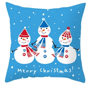 Detail of blue Christmas pillowcase with white snowflakes and three cartoon snowmen pattern