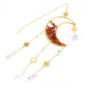 Macro detail of crescent moon suncatcher with reddish crystals and iridescent glass prisms
