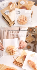 Detail of greaseproof paper bread bags with transparent windows and decorative seal stickers