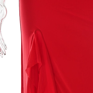 Close-up of red elegant dress featuring pleated mesh fabric and stylish side slit details