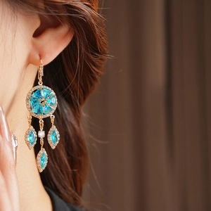 Vintage gold earrings with sky blue rhinestones and diamond-encrusted rhombic tassels