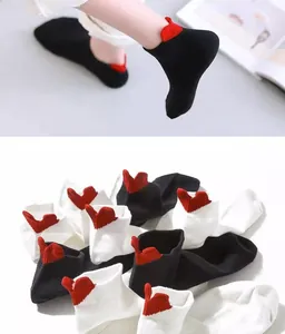 Close-up of cotton low cut socks with 3D red heart embroidery on the heel detail