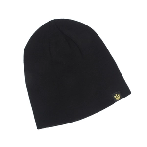 Detail shot of a black knitted beanie featuring a small gold crown logo on a white background
