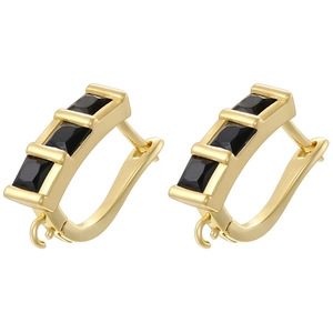 Detail of 18K gold-plated U-shaped earrings with inlaid black rectangular stones