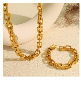 Detailed view of 18k gold plated rectangular link chain necklace and bracelet set