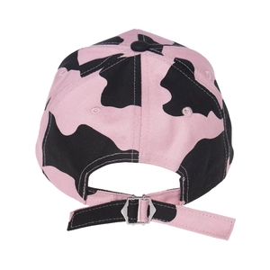 Detailed back view of pink cow print baseball cap with adjustable silver metal buckle