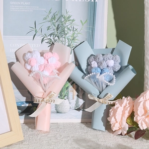 Mini handmade crochet puff flower bouquets in pink and blue gift wrap for Mother's Day