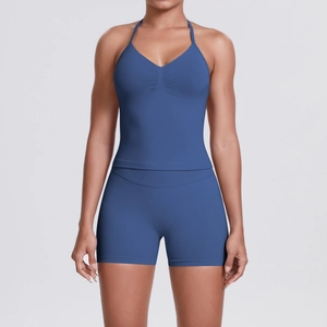 Detail of blue seamless yoga set showing V-neck halter top and ribbed high-waist shorts