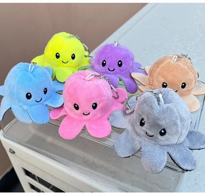 Detailed view of six colorful double-sided octopus plush pendants with metal keyrings