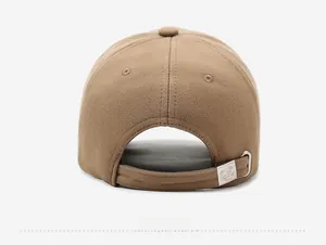 Detail view of khaki baseball cap back with twill fabric and adjustable metal buckle