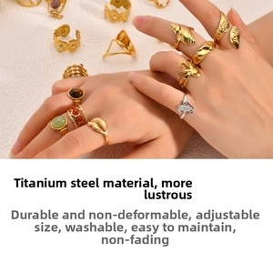 Detailed macro view of 18k gold plated titanium steel adjustable rings with marine motifs