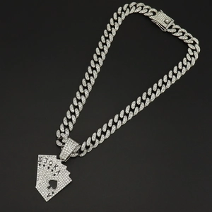Close-up of silver Cuban link necklace with iced out poker royal flush diamond pendant