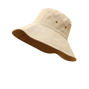Detail view of khaki sun hat featuring breathable metal eyelets and premium cotton canvas