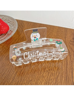 Detail shot of large acrylic hair claw with cute Christmas snowman and snowflake prints