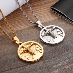 Detail of gold and silver cross pendants featuring the Lord's Prayer on wheat chains