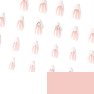 French almond press-on nails in pink and white with elegant 3D silver heart rhinestones
