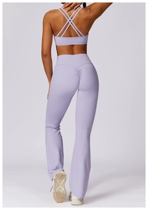 Detailed back view of purple yoga set featuring cross-back bra and flare leggings
