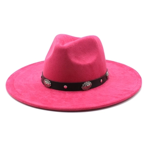 Detail of rose red wool felt fedora featuring black leather band with silver conchos