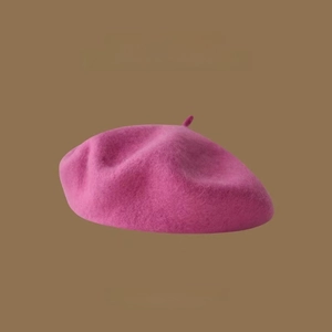 Detail of premium Australian wool beret in magenta with soft felt texture finish