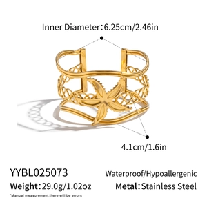 Detail view of 18K gold plated hollow mesh bangle with a central starfish motif