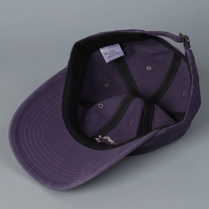 Adjustable purple cotton baseball cap with interior sweatband and metal buckle closure