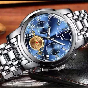 Close-up of a silver stainless steel watch with deep blue dial and Roman numerals